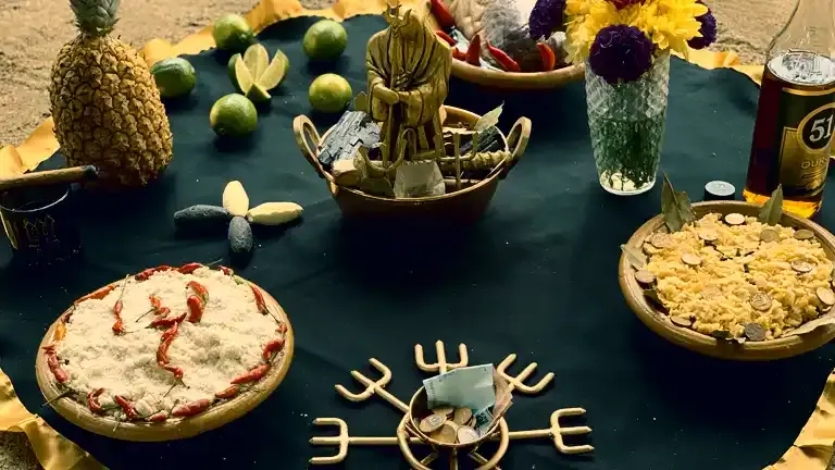 Oferenda a Exu do Ouro com frutas e velas