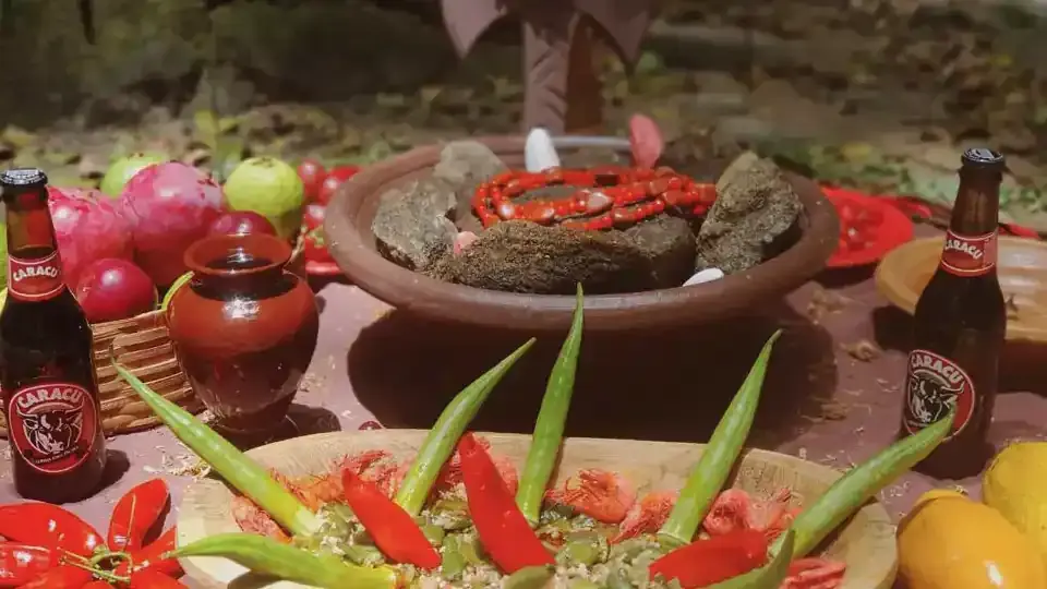 Oferenda a Xangô com quiabos, frutas e cerveja preta